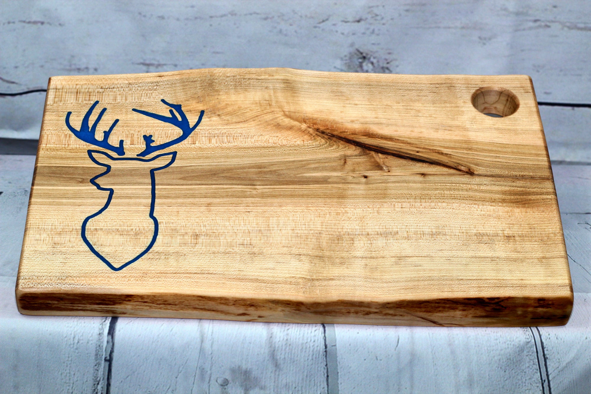 Charcuterie board (live edge maple with blue epoxy deer head)