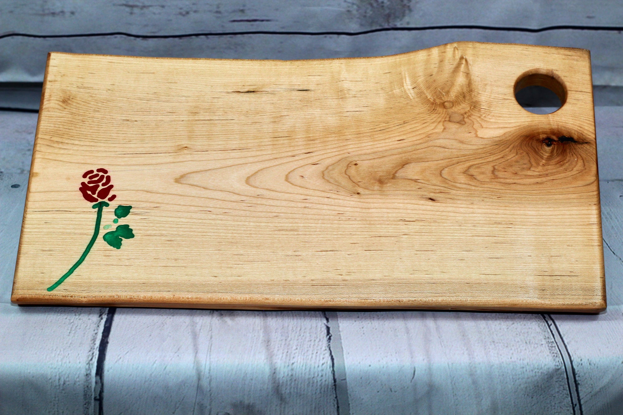 Charcuterie board (live edge maple with red and green epoxy rose)