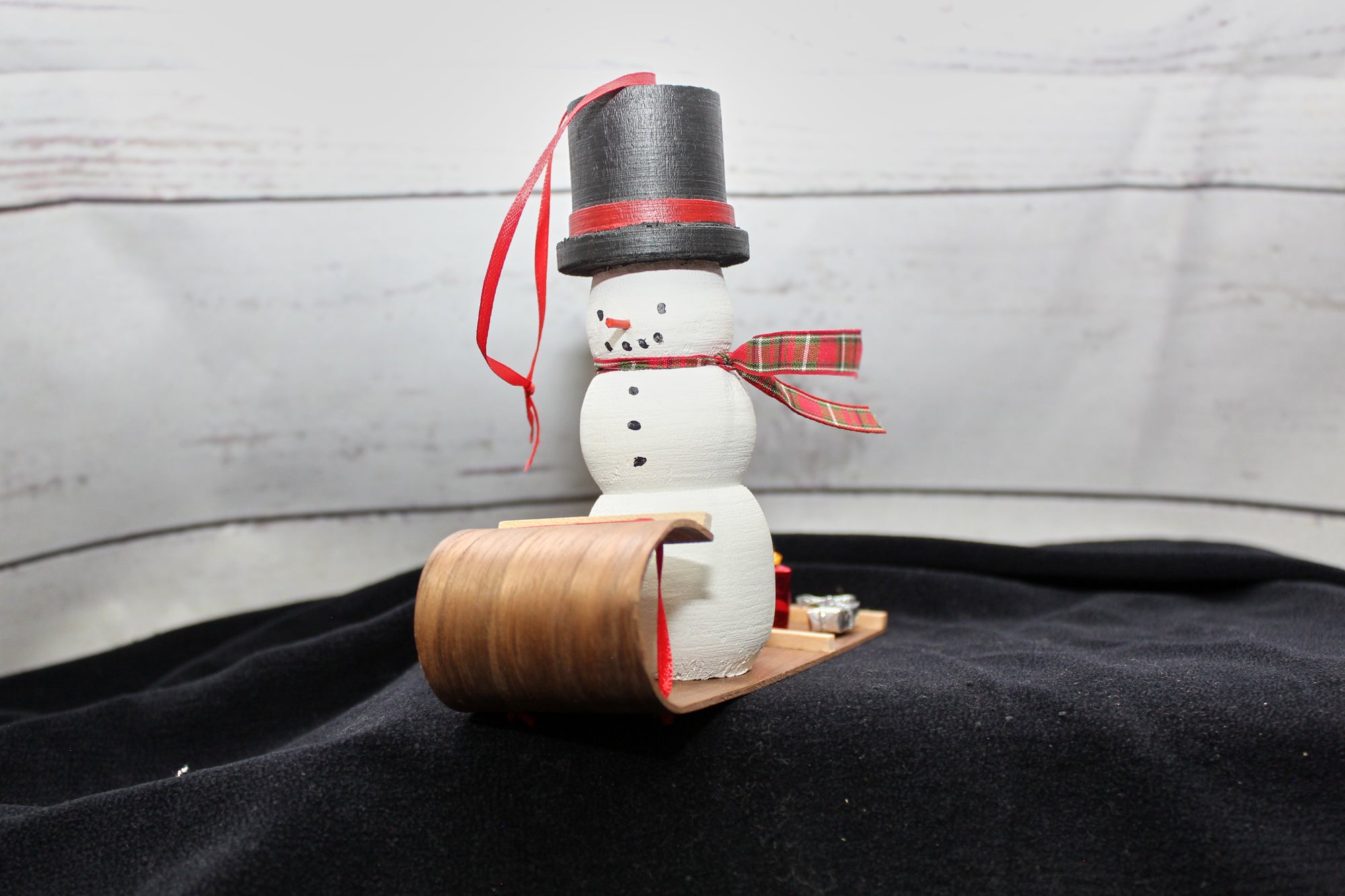Snowman on walnut sled
