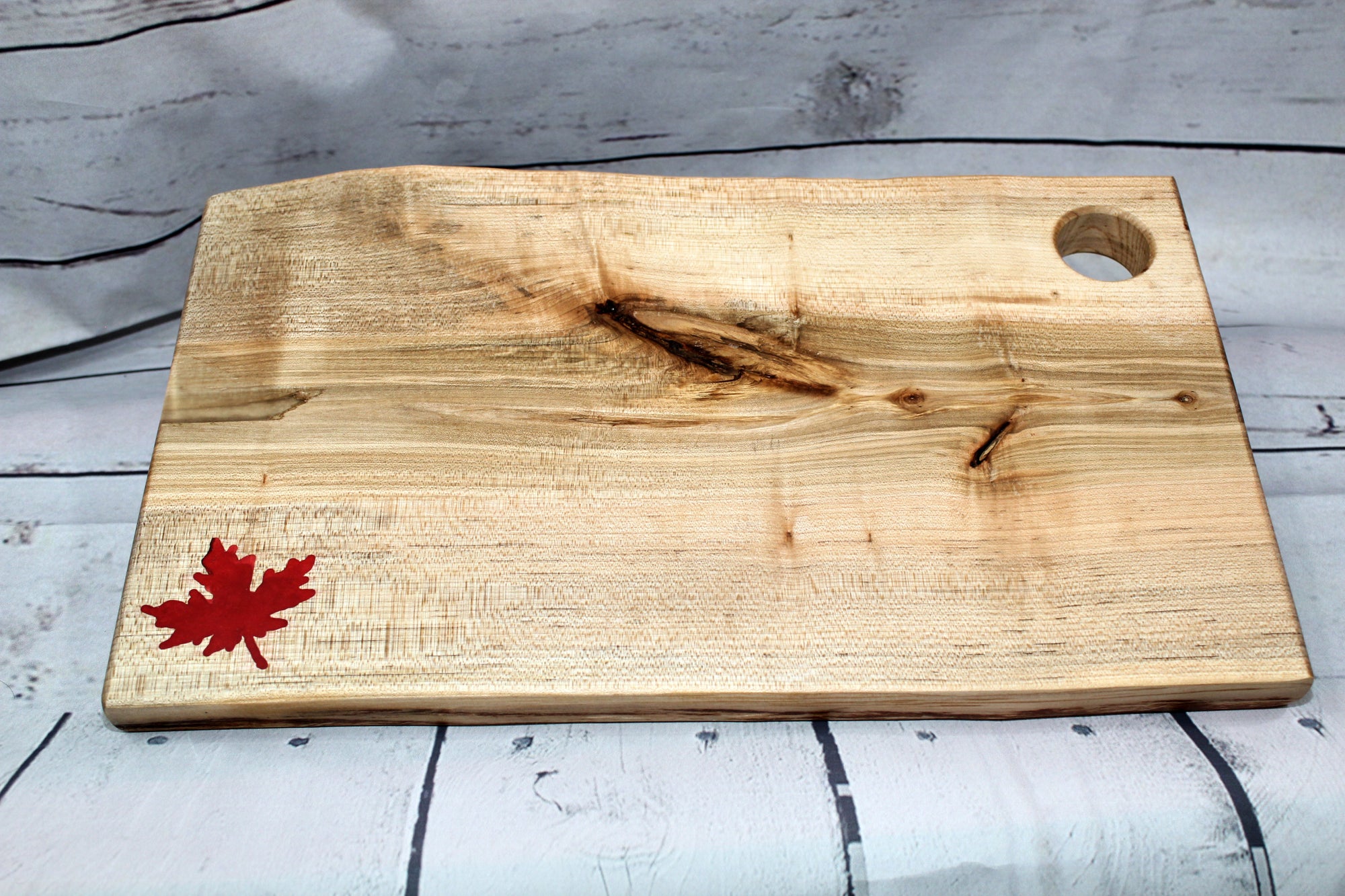 Charcuterie board (live edge maple with red epoxy leaf)